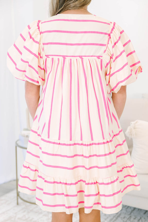 Plus Size pink and cream striped mini dress with puff sleeves, smocked yoke, and tiered skirt.