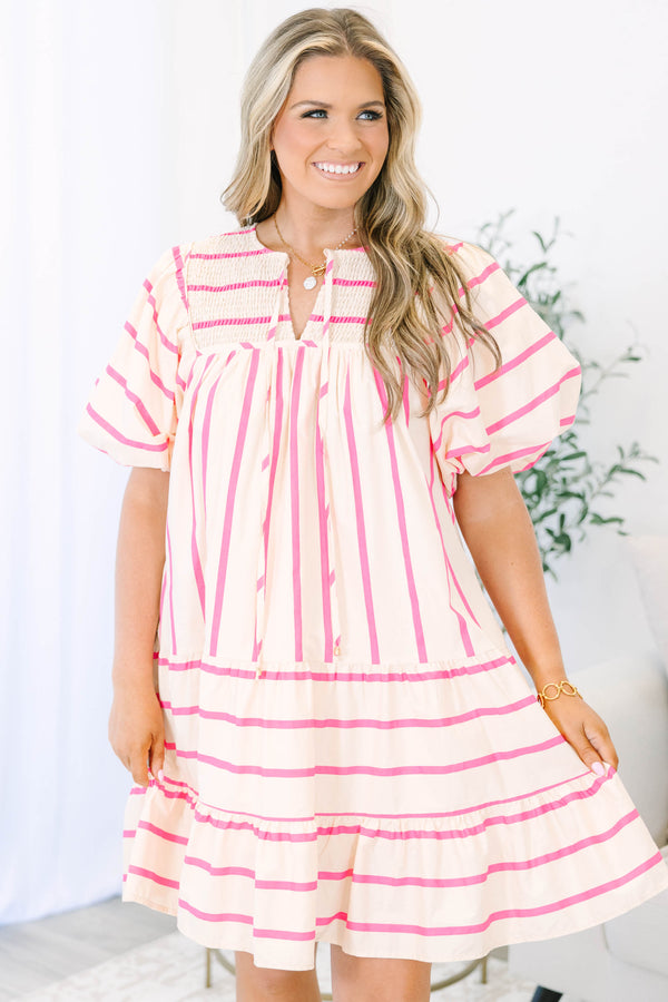 Plus Size pink and cream striped mini dress with puff sleeves, smocked yoke, and tiered skirt.