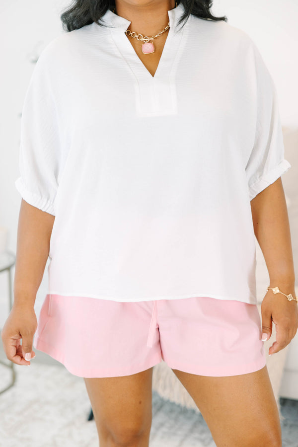 Plus size flowy ivory split v-neck top with relaxed dolman sleeves.