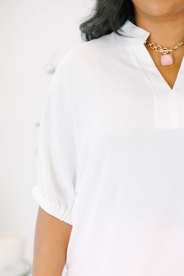 Plus size flowy ivory split v-neck top with relaxed dolman sleeves.