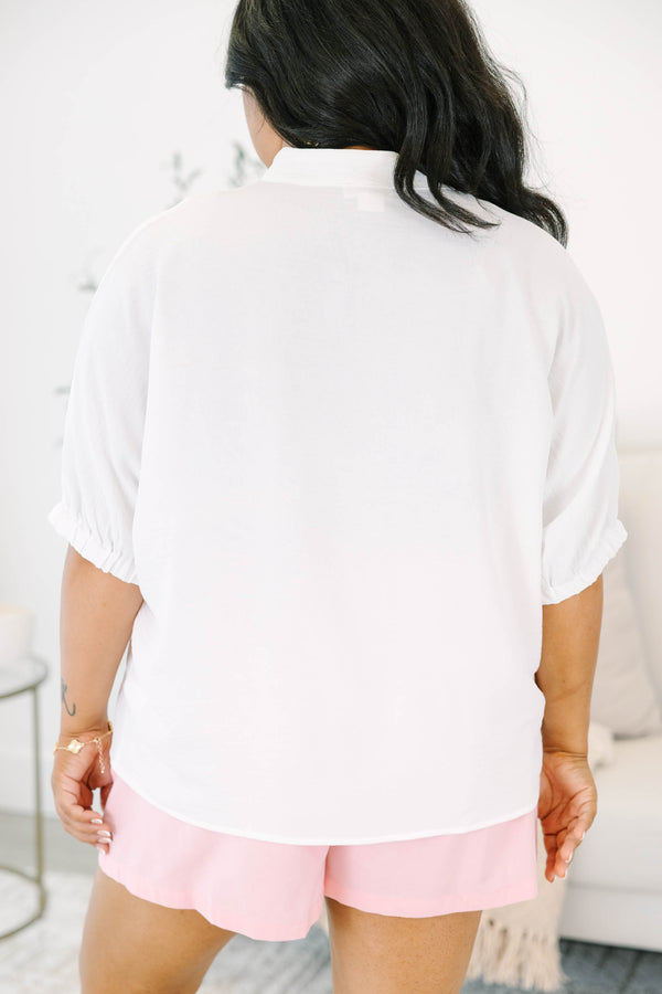 Plus size flowy ivory split v-neck top with relaxed dolman sleeves.