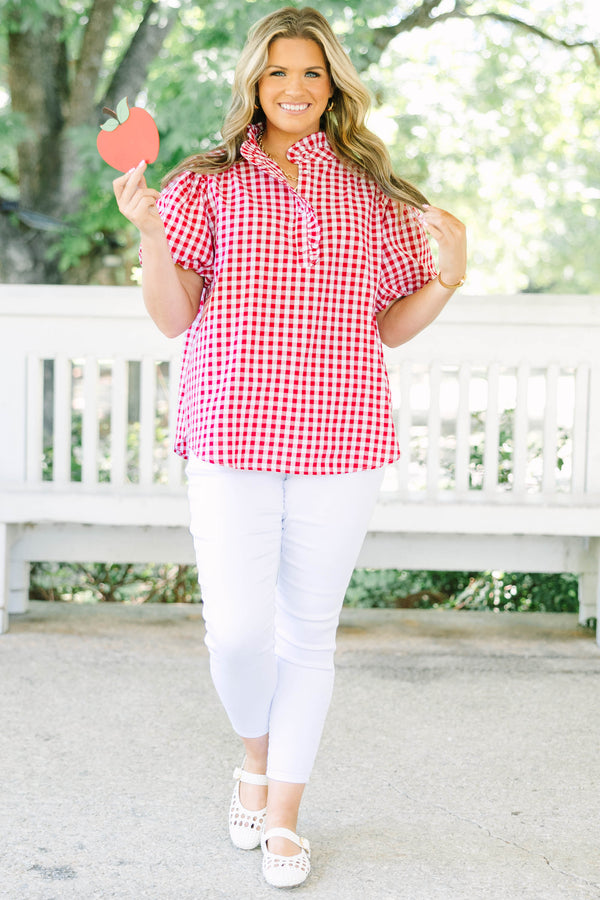 Plus size red and white gingham top with ruffle collar and short puff sleeves.