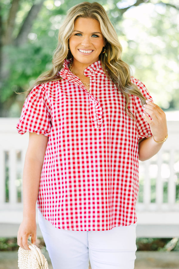 Plus size red and white gingham top with ruffle collar and short puff sleeves.