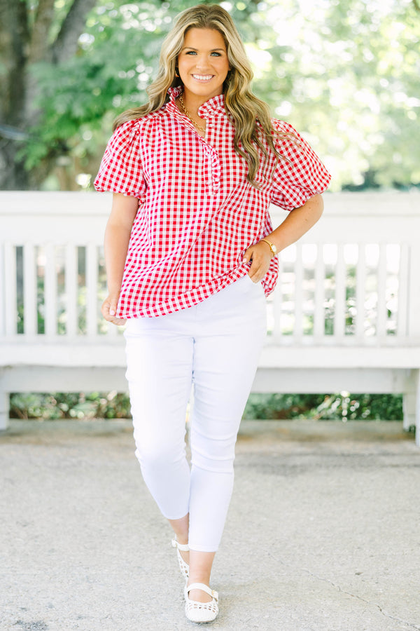 Plus size red and white gingham top with ruffle collar and short puff sleeves.