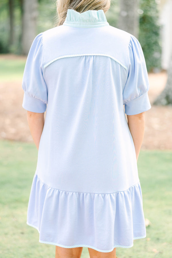 Plus Size light blue cotton dress with short puff sleeves, a collared neckline, and a ruffled hem.