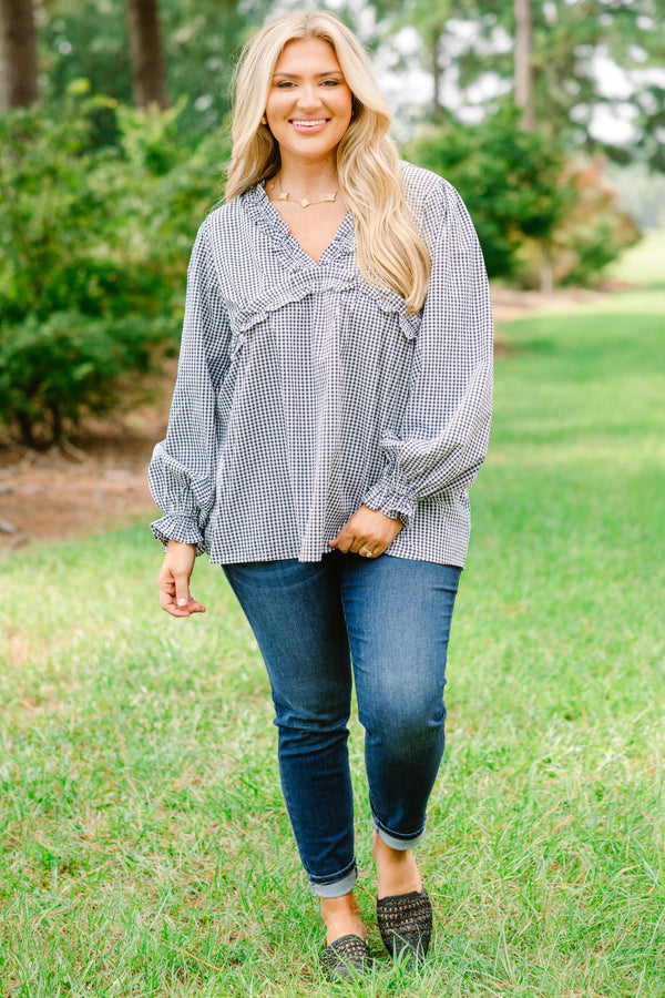 Chic Soul plus size clothing, black and white gingham long sleeve flowy top with ruffle puff sleeves and ruffle detailing around the chest