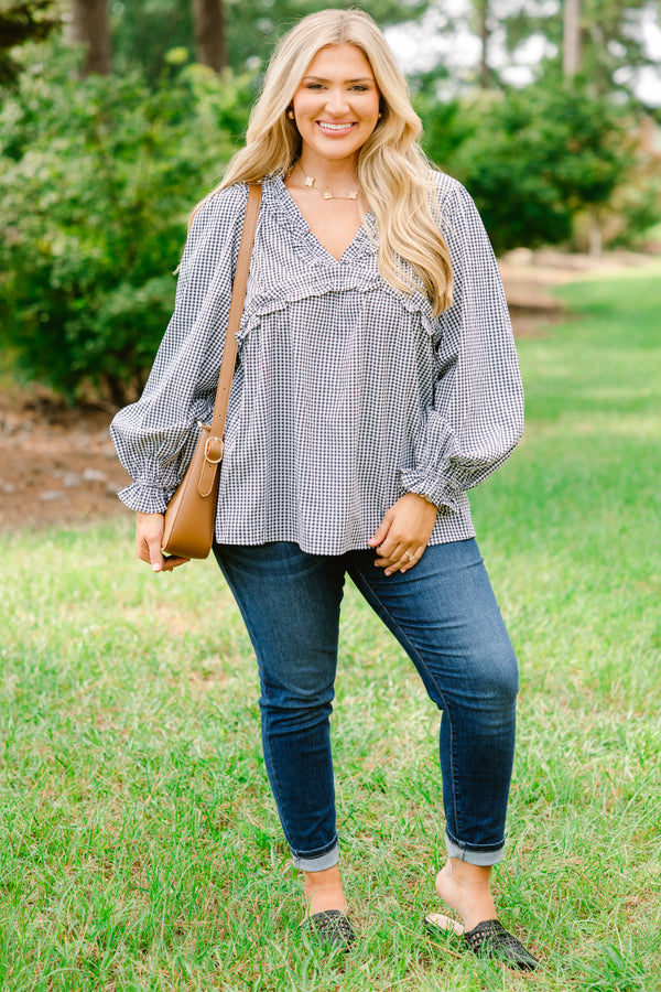 Chic Soul plus size clothing, black and white gingham long sleeve flowy top with ruffle puff sleeves and ruffle detailing around the chest