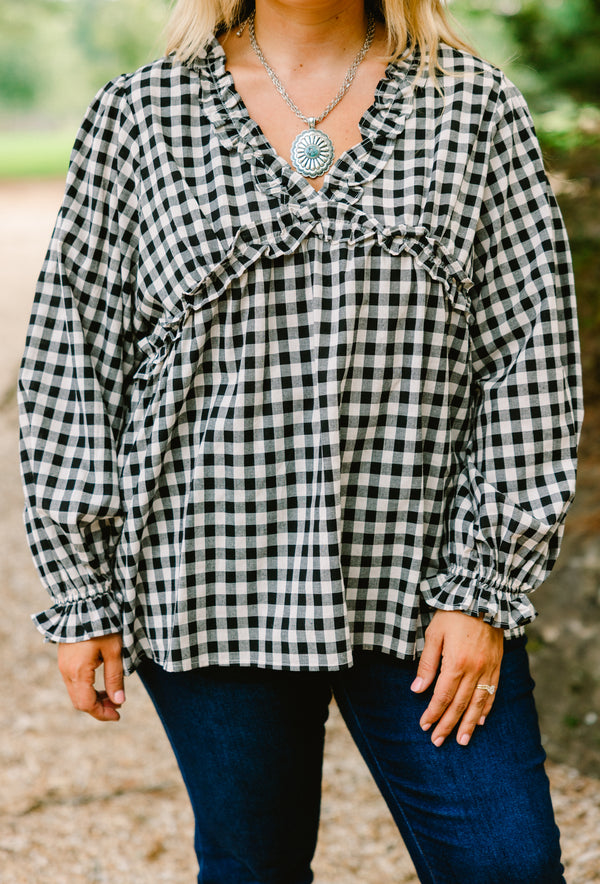 Chic Soul plus size clothing, black gingham long sleeve top with ruffle details at the end of the sleeves and along the chest area and v-neckline 