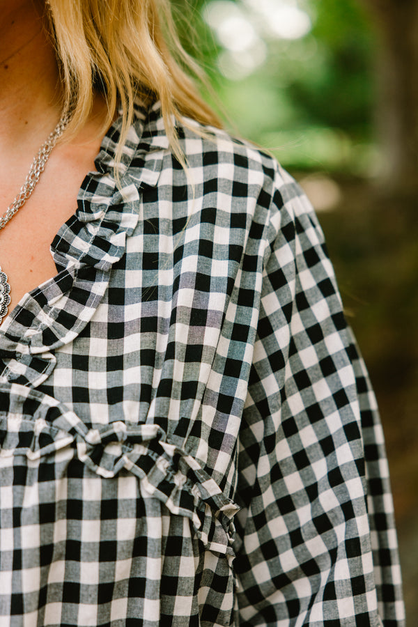 Chic Soul plus size clothing, black gingham long sleeve top with ruffle details at the end of the sleeves and along the chest area and v-neckline 