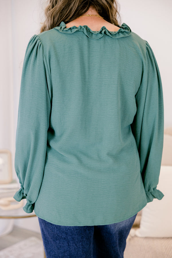 Chic Soul plus size clothing, dark green long sleeve top with ruffles on the end of the sleeves and outlining the chest