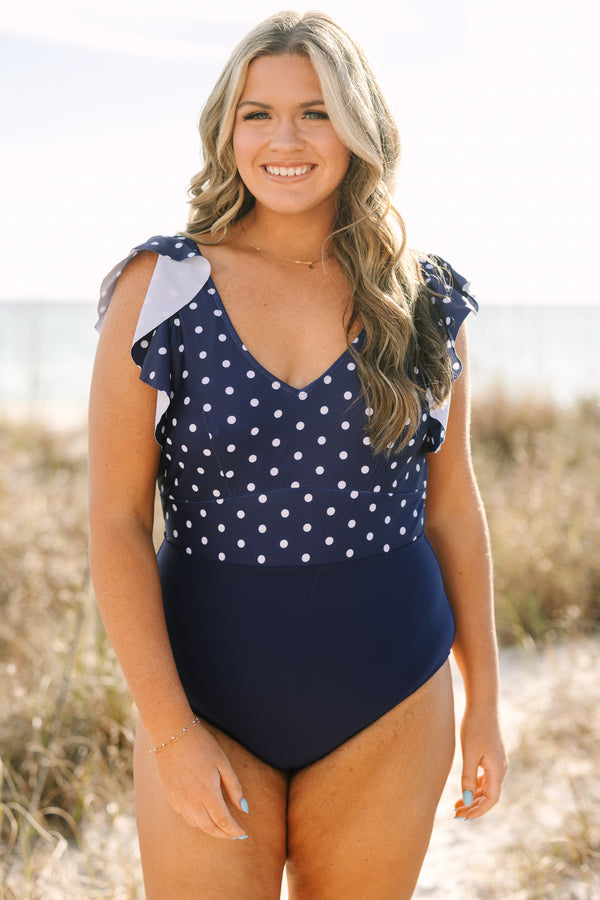 Chic Soul plus size clothing, solid navy blue low back one piece swimsuit with white polka dots on the upper half and ruffle sleeves