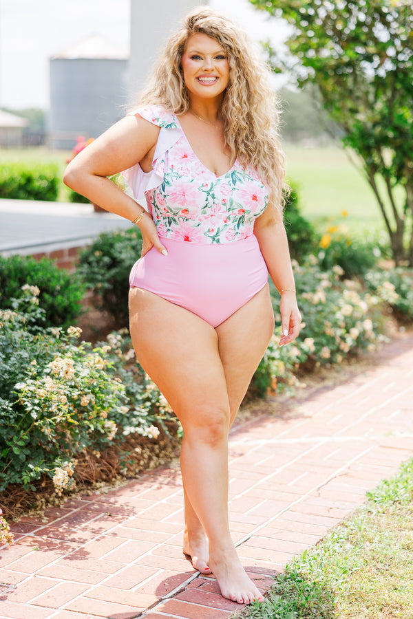 Chic Soul plus size clothing, one piece bathing suit with color block design, bottom being baby pink and top being pink, white, and green floral pattern with ruffled sleeves