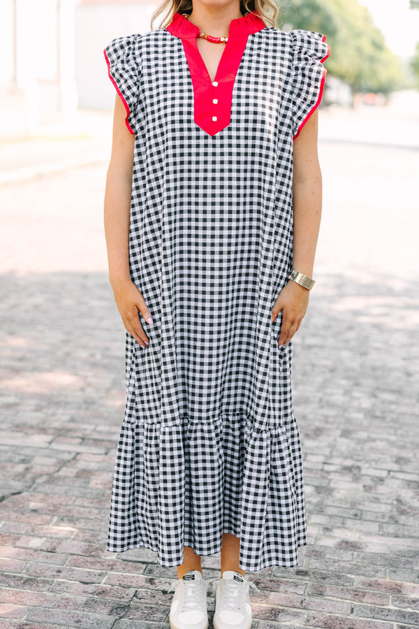 Plus Size black and white gingham maxi dress with red ruffled v-neckline and flutter sleeves.