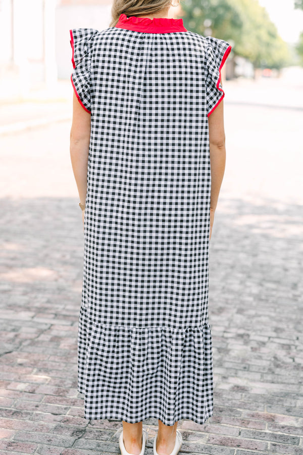 Plus Size black and white gingham maxi dress with red ruffled v-neckline and flutter sleeves.