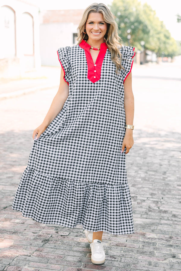 Plus Size black and white gingham maxi dress with red ruffled v-neckline and flutter sleeves.