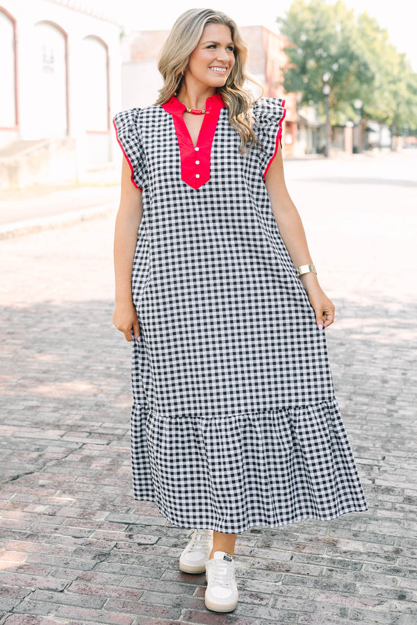 Plus Size black and white gingham maxi dress with red ruffled v-neckline and flutter sleeves.