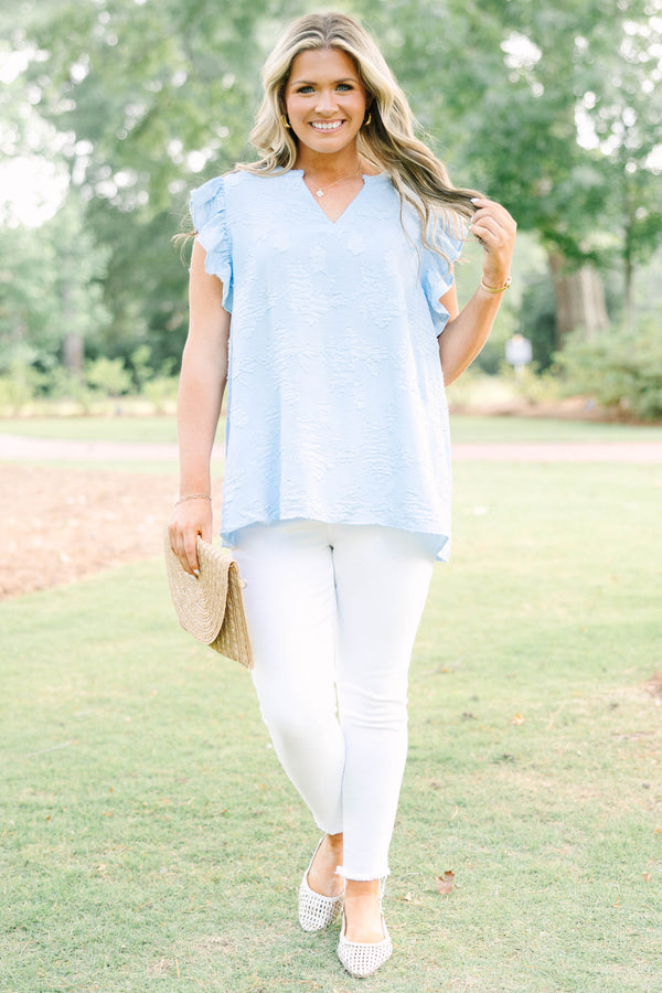 Plus Size baby blue textured top with a V-neckline and ruffled short sleeves.