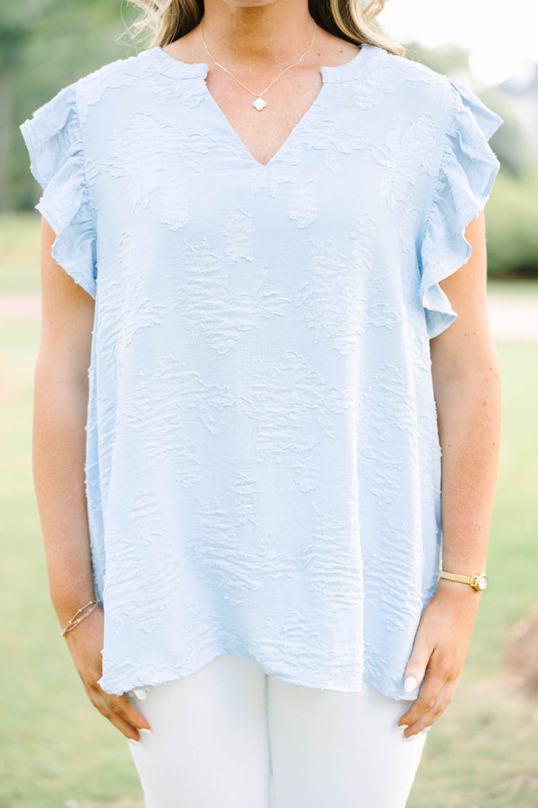 Plus Size baby blue textured top with a V-neckline and ruffled short sleeves.