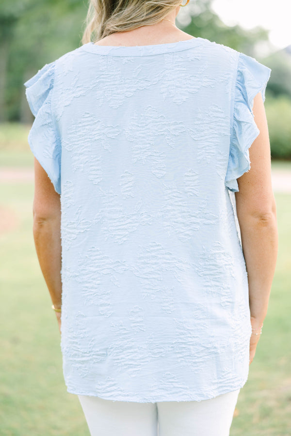 Plus Size baby blue textured top with a V-neckline and ruffled short sleeves.