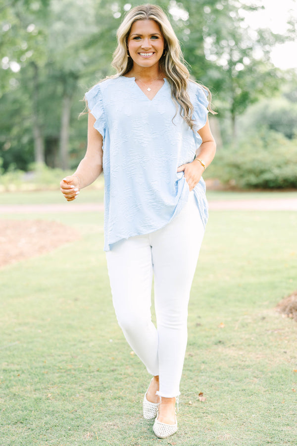 Plus Size baby blue textured top with a V-neckline and ruffled short sleeves.