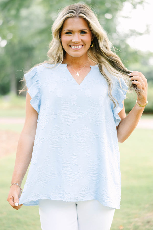 Plus Size baby blue textured top with a V-neckline and ruffled short sleeves.