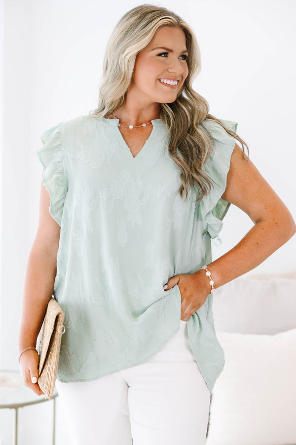 Plus size sage floral top with ruffle sleeves and a flowy fit