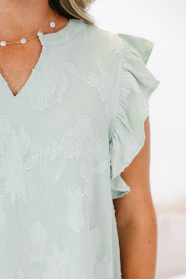 Plus size sage floral top with ruffle sleeves and a flowy fit