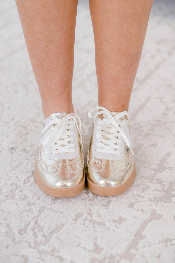 Chic Soul plus size clothing, gold sneakers with a taupe platform and a white stripe detail on one side of each sneaker 