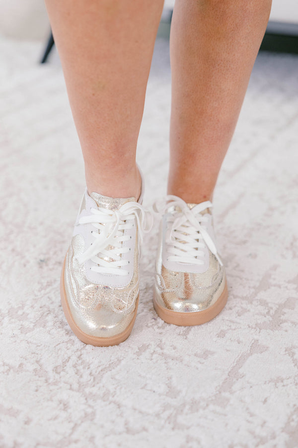 Chic Soul plus size clothing, gold sneakers with a taupe platform and a white stripe detail on one side of each sneaker 