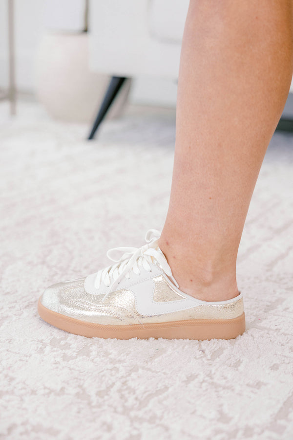 Chic Soul plus size clothing, gold sneakers with a taupe platform and a white stripe detail on one side of each sneaker 
