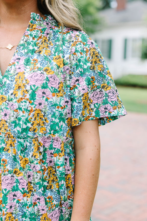 Plus Size cream floral tiered maxi dress with short flutter sleeves and a V-neckline.