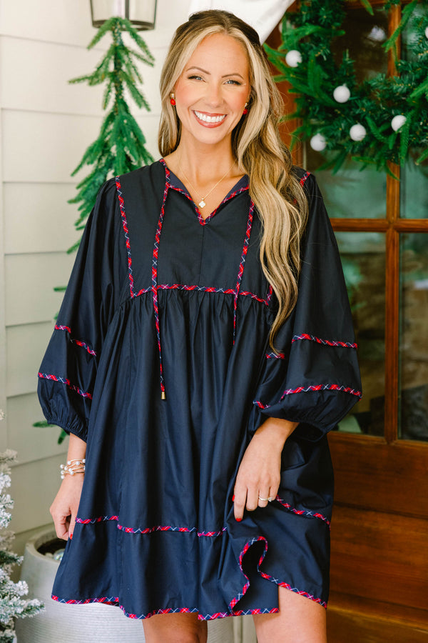 Chic Soul plus size clothing, navy puff long sleeve short dress with red and blue plaid trim along sleeves, bottom of dress, drawstrings, and top