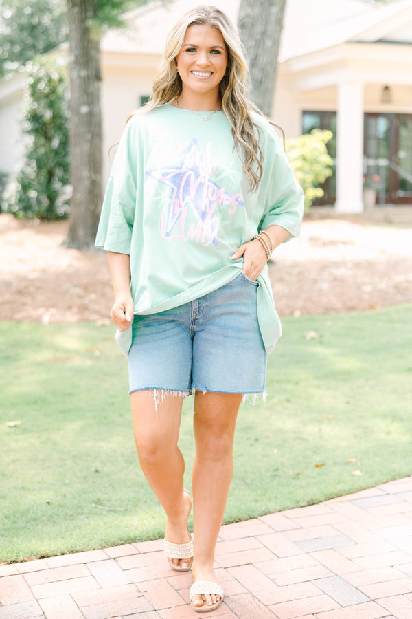 Plus size light sage boyfriend tee with 'Cool Moms Club' graphic and a relaxed, flowy fit.
