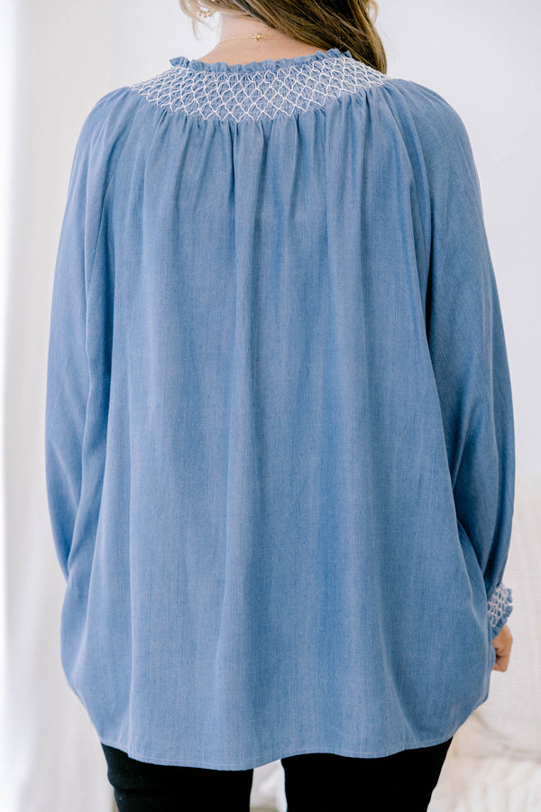 Chic soul plus size clothing, long sleeve flowy denim blouse with white stitching detailing around the collar and cuff of the sleeves, with 2 drawstrings at the collar
