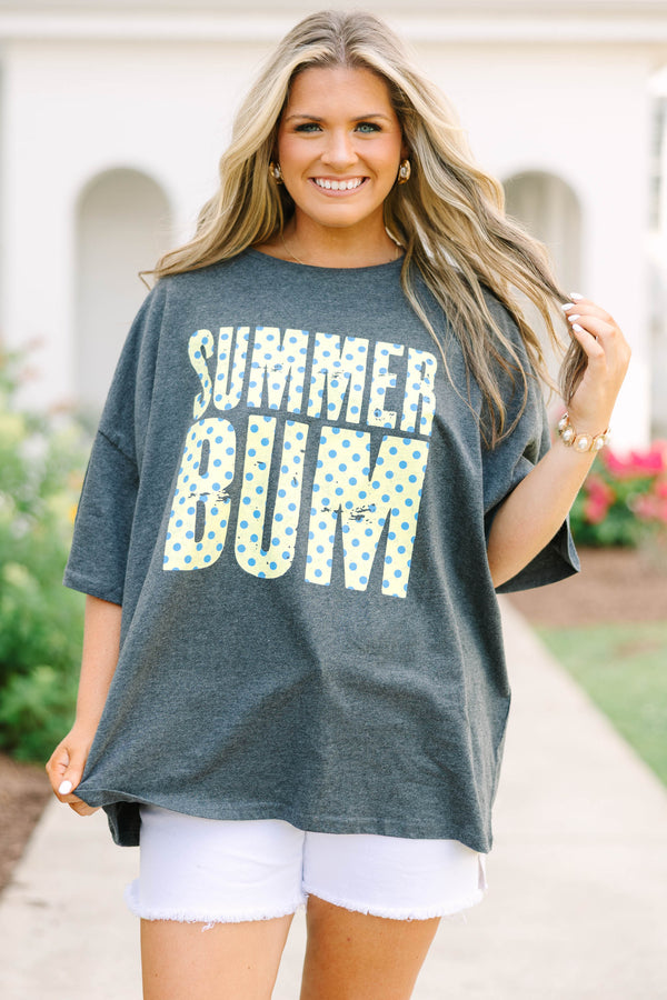 Plus Size charcoal boyfriend tee with yellow and blue polka dot 'SUMMER BUM' text and white shorts.