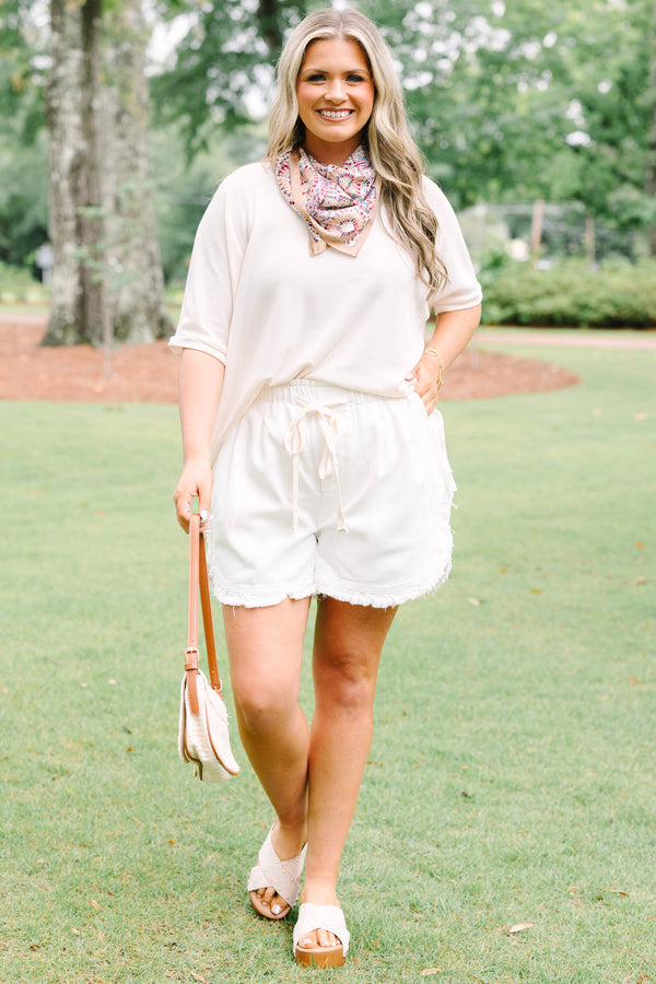 Plus Size ivory drawstring shorts with a frayed hem and elastic waistband.