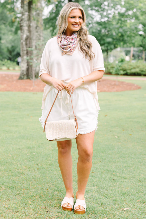 Plus Size ivory drawstring shorts with a frayed hem and elastic waistband.