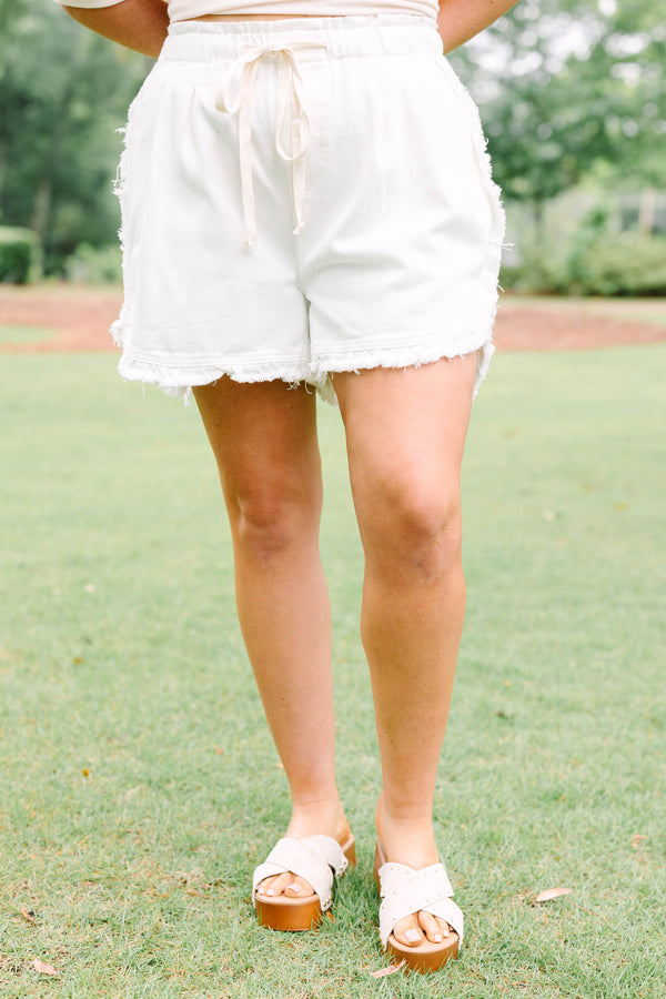 Plus Size ivory drawstring shorts with a frayed hem and elastic waistband.