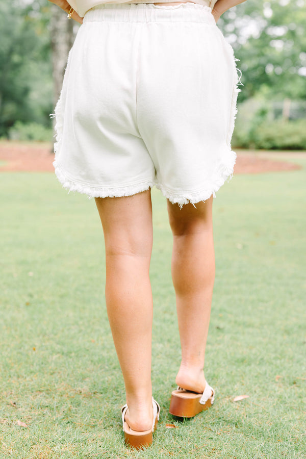 Plus Size ivory drawstring shorts with a frayed hem and elastic waistband.
