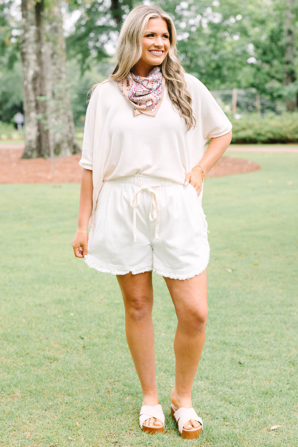 Plus Size ivory drawstring shorts with a frayed hem and elastic waistband.