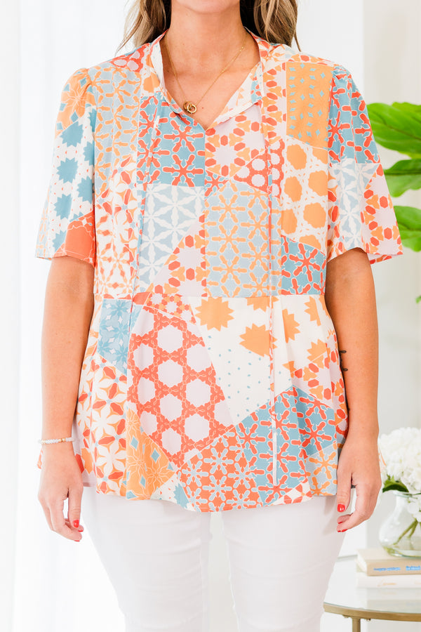 Chic Soul plus size clothing, orange short sleeve geometric multi pattern top with v neckline with tie detail