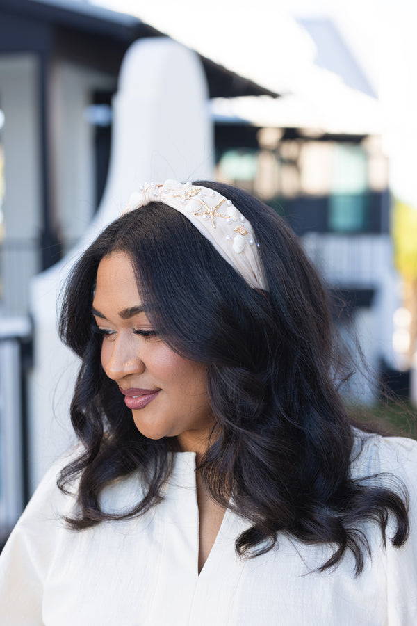 Chic Soul plus size clothing, cream and tan burlap style headband with knot in the middle and gold starfish, beige shells, and pearls sown into the headband