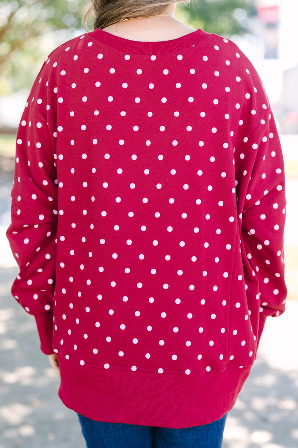 Plus size Sunset Glow Pullover in burgundy with white polka dots, featuring a relaxed, flowy fit.