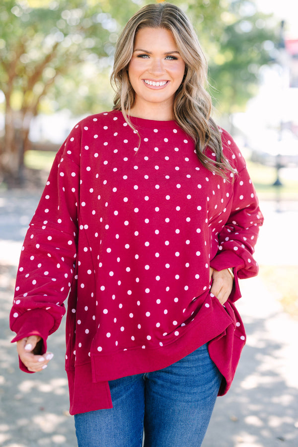 Plus size Sunset Glow Pullover in burgundy with white polka dots, featuring a relaxed, flowy fit.