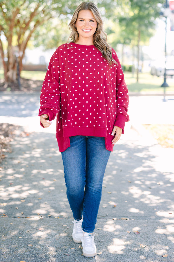 Plus size Sunset Glow Pullover in burgundy with white polka dots, featuring a relaxed, flowy fit.