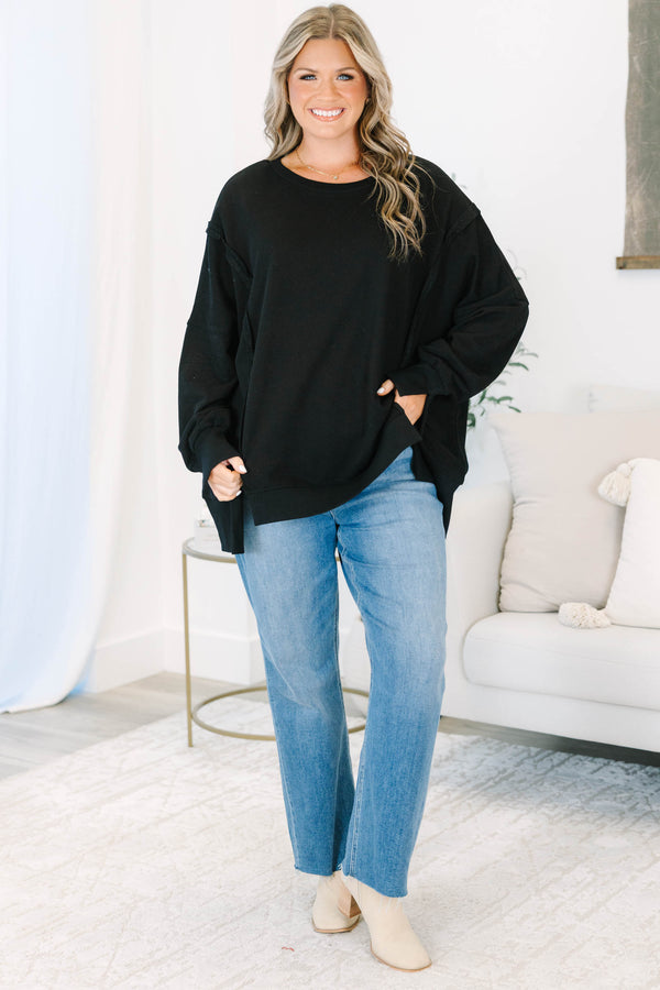 Plus size Sunset Glow Pullover in black, featuring a relaxed fit, crew neck, and raw seam details.