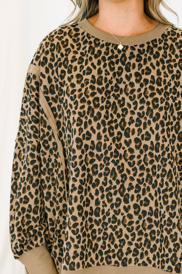 Plus Size brown leopard print pullover with a crew neckline, long sleeves, and ribbed trim.