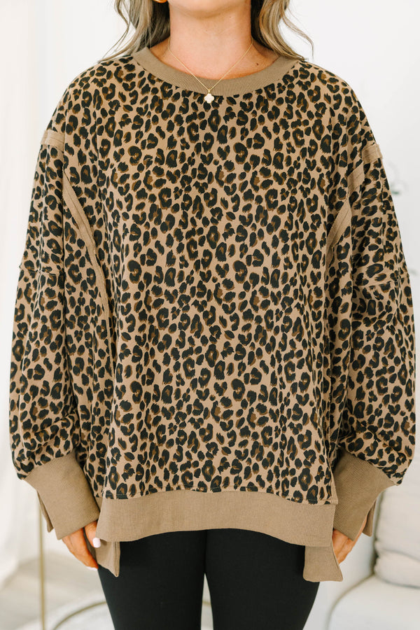 Plus Size brown leopard print pullover with a crew neckline, long sleeves, and ribbed trim.