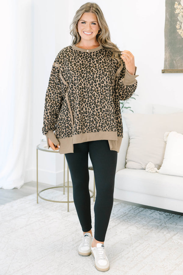 Plus Size brown leopard print pullover with a crew neckline, long sleeves, and ribbed trim.