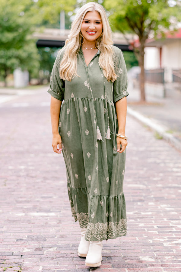 Chic Soul plus size clothing, green maxi dress with short sleeves that have a cuff at the end of each sleeve as well as a block pattern throughout and tassels hanging from the neckline 